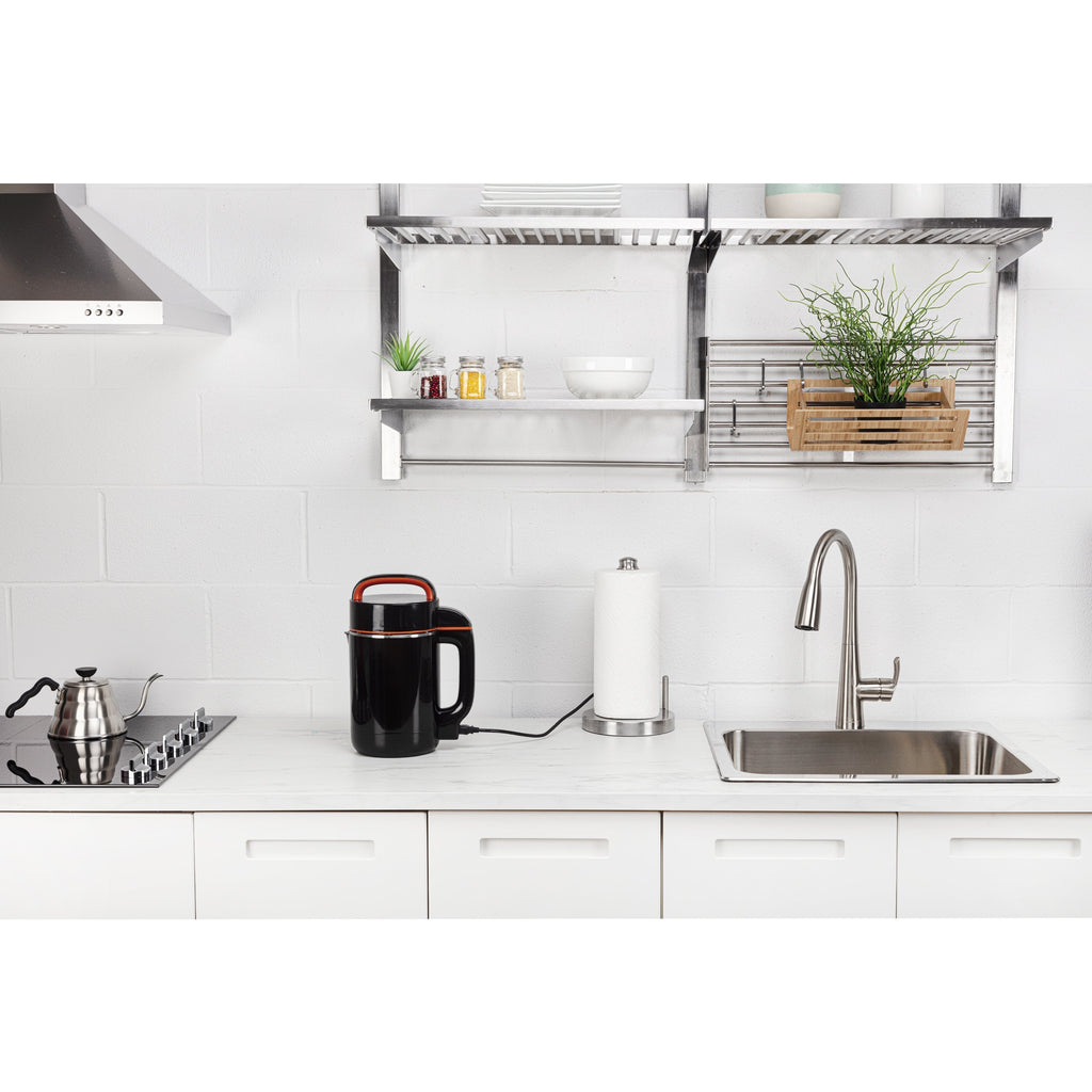 Modern kitchen with white cabinets, stainless steel appliances, and a clean countertop.