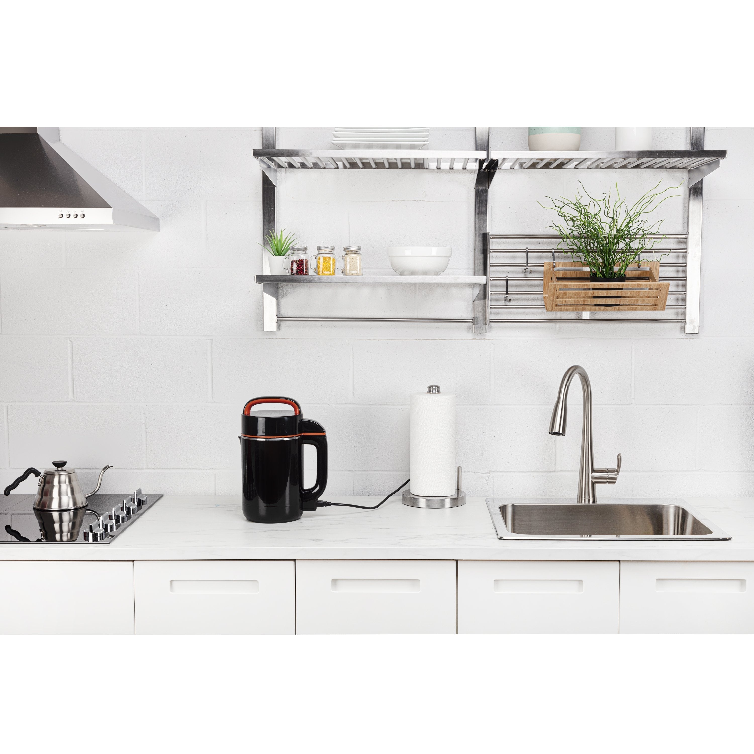 Modern kitchen with white cabinets, stainless steel appliances, and a clean countertop.