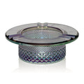 Glass ashtray with diamond pattern on a white background