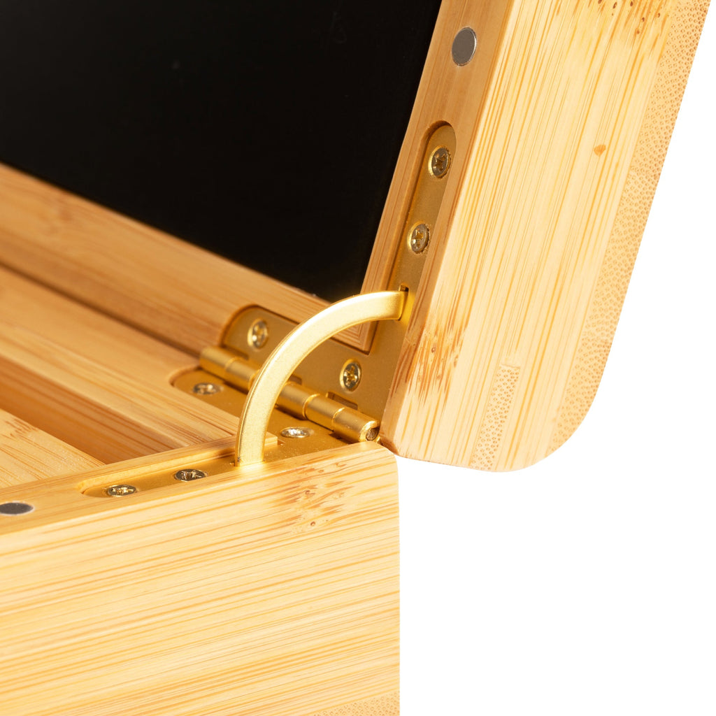Close-up of a wooden box with a gold hinge on a white background