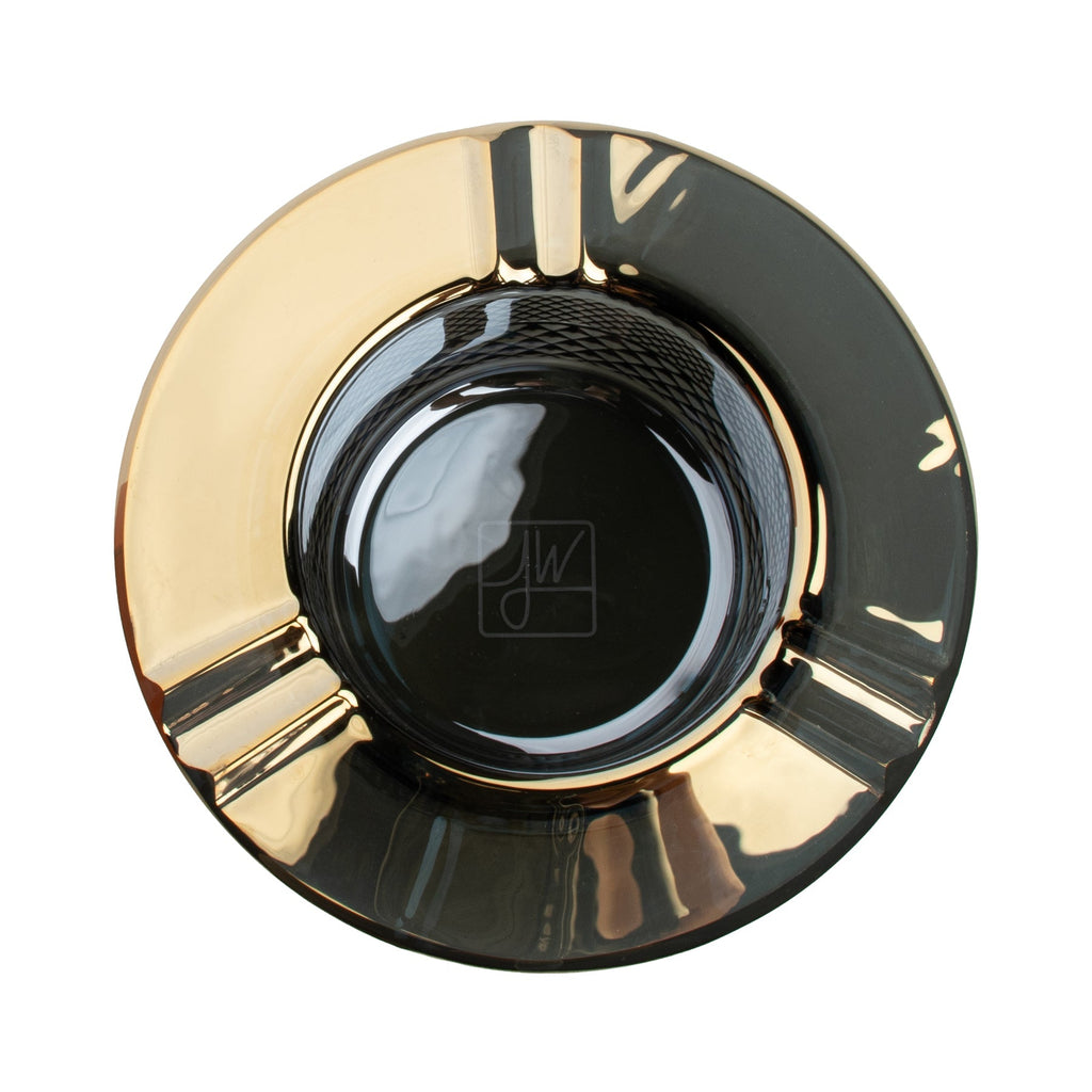 top view of gold decorative item with a brand logo on a white background