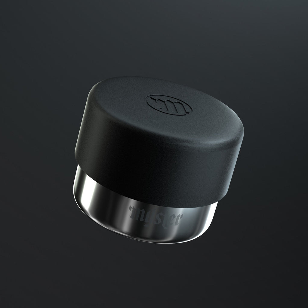 Black and silver ashtray cap on a dark background