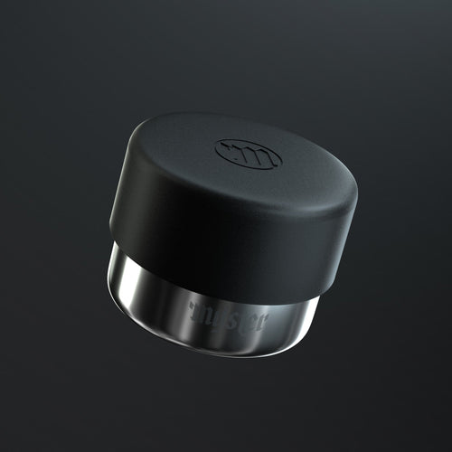 Black and silver ashtray cap on a dark background