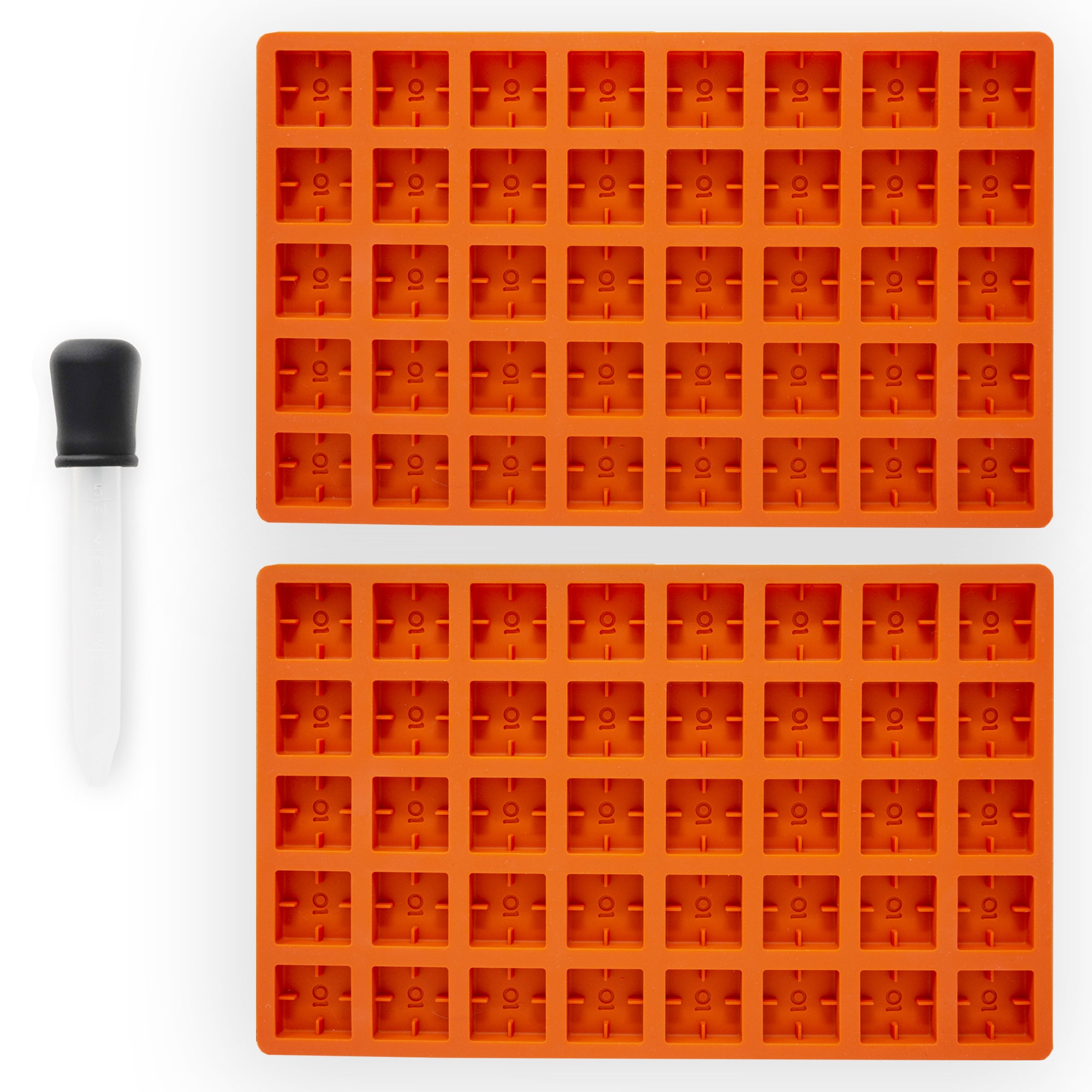 Two orange silicone molded trays on a white background
